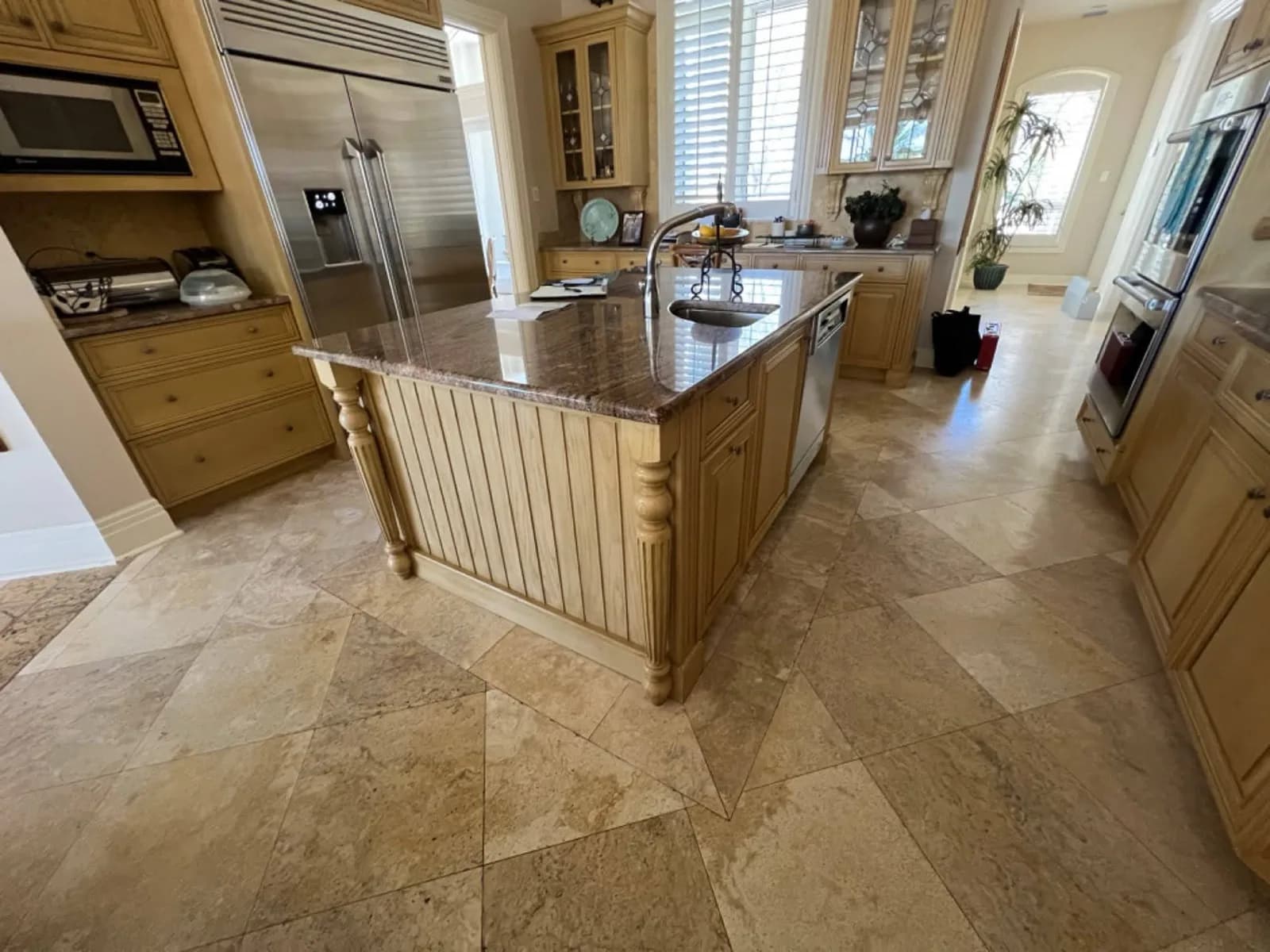 Kitchen island with granite and timber cabinets before refinishing