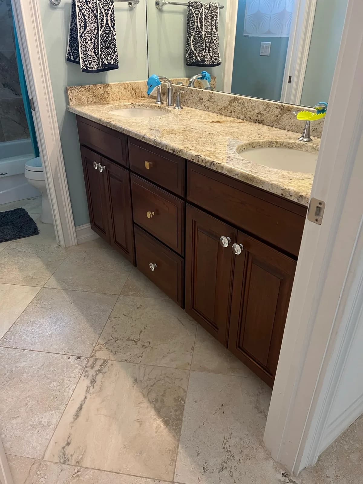 The same bathroom vanity in dark timber before refinishing
