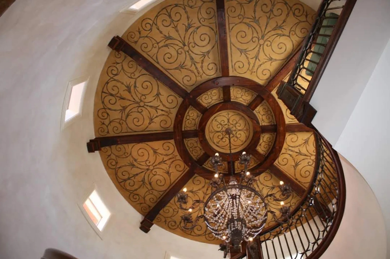 Domed ceiling with hand-applied gold stencil work and ironwork