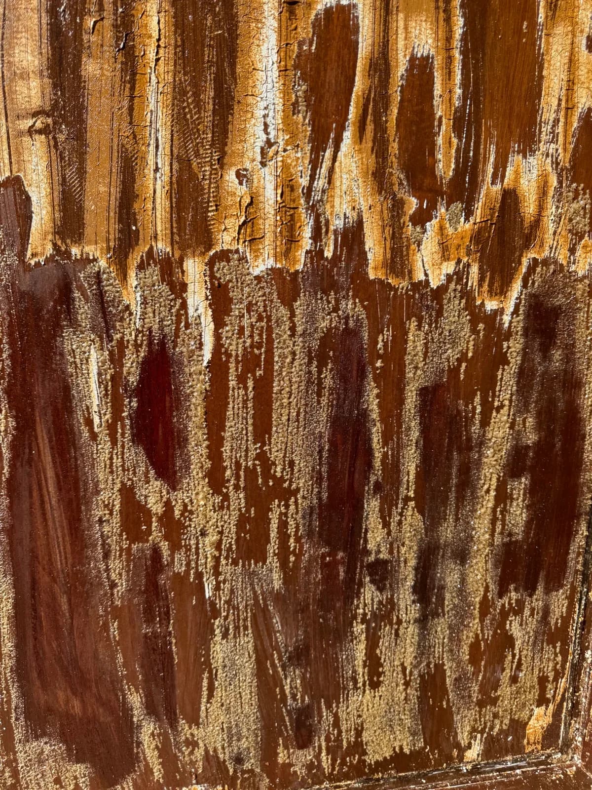 Timber door stripped back showing the old finish lifting