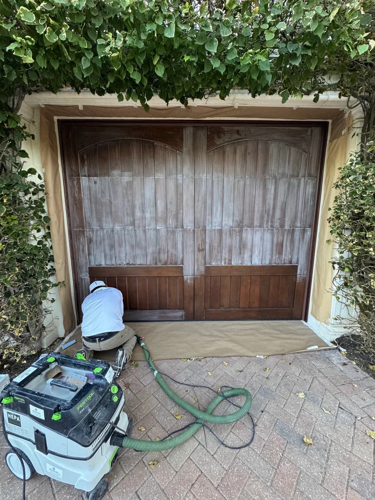 Garage door stripped back to bare timber on site