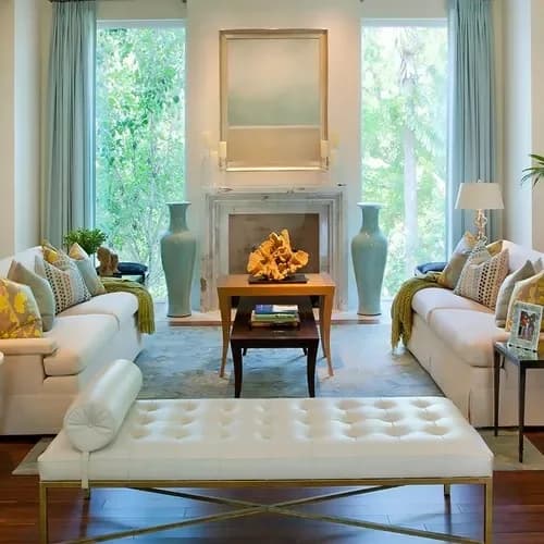 Living room with a painted fireplace wall and tall windows
