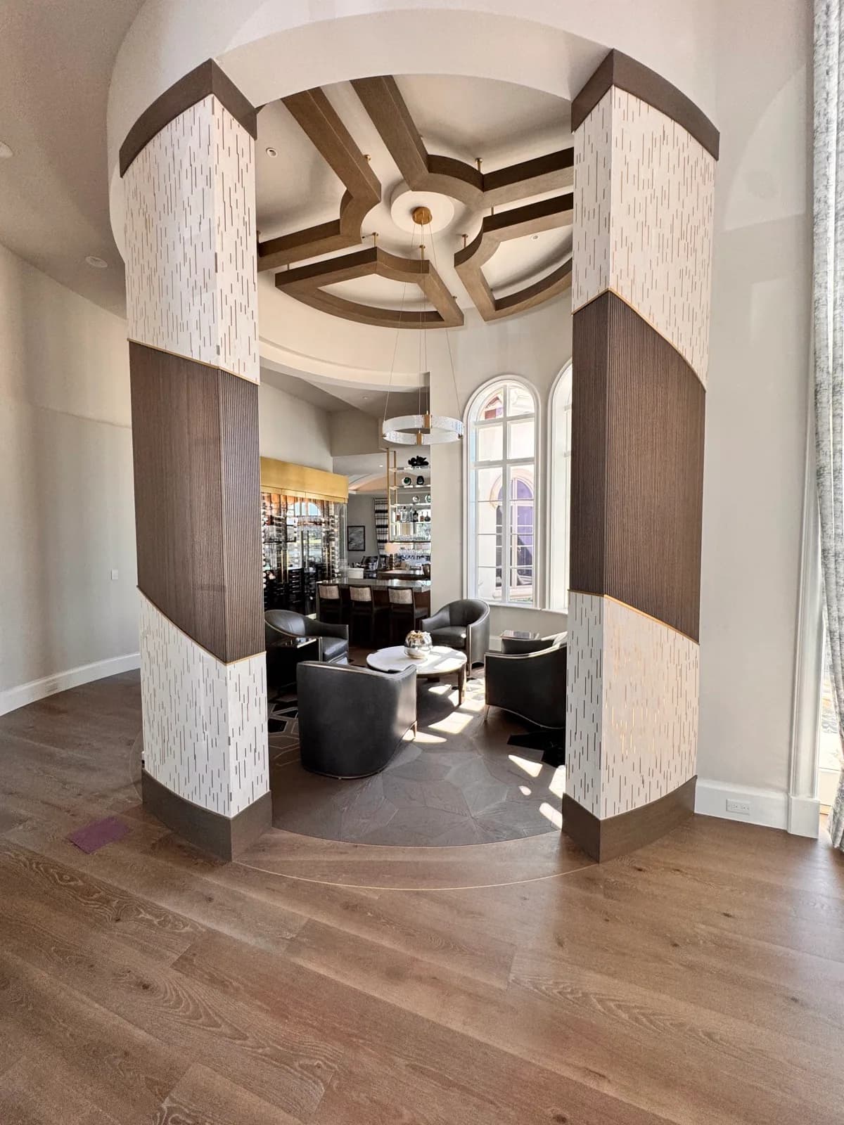 Rotunda with painted columns and a detailed ceiling